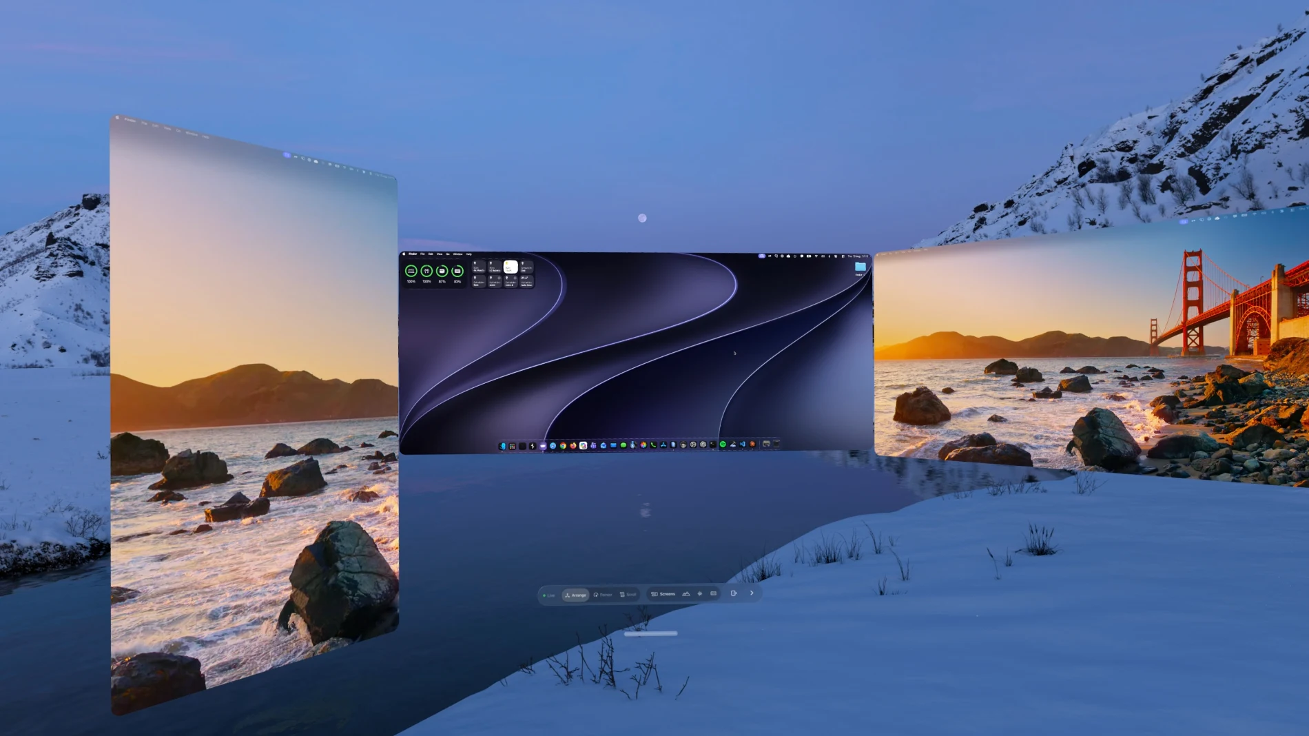 Three streamed Mac displays curved around the wearer in a snow-covered valley